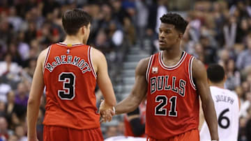 Mar 14, 2016; Toronto, Ontario, CAN; Chicago Bulls forward Jimmy Butler (21) talks to forward Doug McDermott (3) against the Toronto Raptors at Air Canada Centre. The Bulls beat the Raptors 109-107. Mandatory Credit: Tom Szczerbowski-USA TODAY Sports