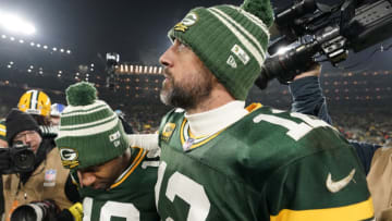 GREEN BAY, WISCONSIN - JANUARY 08: Aaron Rodgers #12 and Randall Cobb #18 of the Green Bay Packers walk off the field after losing to the Detroit Lions at Lambeau Field on January 08, 2023 in Green Bay, Wisconsin. (Photo by Patrick McDermott/Getty Images)