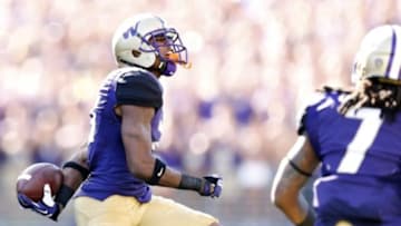 Sep 20, 2014; Seattle, WA, USA; Washington Huskies defensive back Marcus Peters (21) celebrates his interception against the Georgia State Panthers during the first quarter at Husky Stadium. Mandatory Credit: Joe Nicholson-USA TODAY Sports