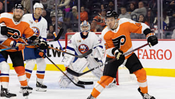 Oct 4, 2022; Philadelphia, Pennsylvania, USA; Philadelphia Flyers right wing Hayden Hodgson (42) tips the puck against New York Islanders goaltender Ilya Sorokin (30) during the second period at Wells Fargo Center. Mandatory Credit: Bill Streicher-USA TODAY Sports