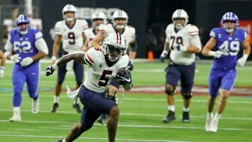 LAS VEGAS, NEVADA - SEPTEMBER 04: Wide receiver BJ Casteel #5 of the Arizona Wildcats scores a touchdown on a 29-yard pass play against the Brigham Young Cougars during the Good Sam Vegas Kickoff Classic at Allegiant Stadium on September 4, 2021 in Las Vegas, Nevada. The Cougars defeated the Wildcats 24-16. (Photo by Ethan Miller/Getty Images)
