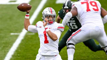 Ohio State's Justin Fields throws a pass against MSU during the first quarter on Saturday, Dec. 5, 2020, at Spartan Stadium in East Lansing.201205 Msu Osu 039a