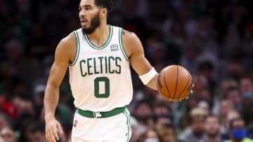 BOSTON, MA - DECEMBER 01: Jayson Tatum #0 of the Boston Celtics dribbles the ball up court during a game against the Philadelphia 76ers at TD Garden on December 1, 2021 in Boston, Massachusetts. NOTE TO USER: User expressly acknowledges and agrees that, by downloading and or using this photograph, User is consenting to the terms and conditions of the Getty Images License Agreement. (Photo by Adam Glanzman/Getty Images)