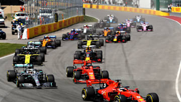 MONTREAL, QUEBEC - JUNE 09: Sebastian Vettel of Germany driving the (5) Scuderia Ferrari SF90 leads Lewis Hamilton of Great Britain driving the (44) Mercedes AMG Petronas F1 Team Mercedes W10 and the rest of the field at the start during the F1 Grand Prix of Canada at Circuit Gilles Villeneuve on June 09, 2019 in Montreal, Canada. (Photo by Mark Thompson/Getty Images)