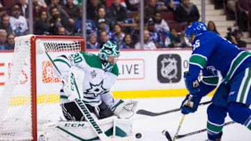 VANCOUVER, BC - OCTOBER 30: Dallas Stars Goalie Ben Bishop (30) makes a save on Vancouver Canucks Defenceman Alex Biega (55) in a NHL hockey game on October 30, 2017, at Rogers Arena in Vancouver, BC. (Photo by Bob Frid/Icon Sportswire via Getty Images)