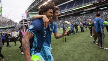 Oct 23, 2016; Seattle, WA, USA; Seattle Sounders FC defender Roman Torres (left) celebrates with midfielder Alvaro Fernandez (right) after a game against Real Salt Lake at CenturyLink Field. Seattle won 2-1. Mandatory Credit: Jennifer Buchanan-USA TODAY Sports