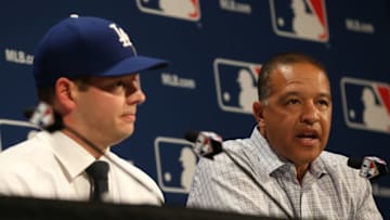 Dec 5, 2016; National Harbor, MD, USA; Los Angeles Dodgers Dodgers manager Dave Rogers (right) speaks as Dodgers pitcher Rich Hill (left) listens during a press conference announcing Hill