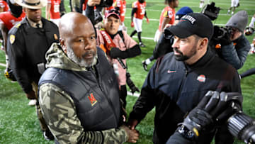COLLEGE PARK, MARYLAND - NOVEMBER 19: Head coaches Michael Locksley of the Maryland Terrapins and Ryan Day of the Ohio State Buckeyes shake hands after the game at SECU Stadium on November 19, 2022 in College Park, Maryland. (Photo by G Fiume/Getty Images)