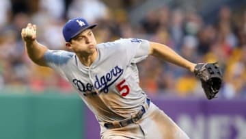 Jun 24, 2016; Pittsburgh, PA, USA; Los Angeles Dodgers shortstop Corey Seager (5) throws to first base too late to retire Pittsburgh pirates left fielder Starling Marte (not pictured) during the fifth inning at PNC Park. Mandatory Credit: Charles LeClaire-USA TODAY Sports