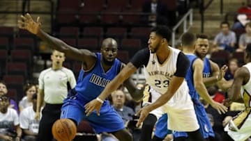 Oct 1, 2016; Bossier City, LA, USA; New Orleans Pelicans forward Anthony Davis (23) passes the ball by Dallas Mavericks forward Quincy Acy (4) during the first half at CenturyLink Center. Mandatory Credit: Ray Carlin-USA TODAY Sports