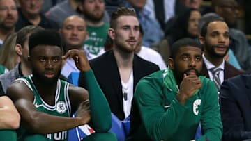 BOSTON - NOVEMBER 16: Injured Boston Celtics forward Gordon Hayward, center rear, sits behind teammates Jaylen Brown, left, and Kyrie Irving at the Boston bench during the first half. The Boston Celtics host the Golden State Warriors in a regular season NBA basketball game at TD Garden in Boston on Nov. 16, 2017. (Photo by Jim Davis/The Boston Globe via Getty Images)