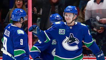 21VANCOUVER, BC - JANUARY 16: Jake Virtanen #18 of the Vancouver Canucks is congratulated by teammate J.T. Miller #9 after scoring during their NHL game against the Arizona Coyotes at Rogers Arena January 16, 2020 in Vancouver, British Columbia, Canada. (Photo by Jeff Vinnick/NHLI via Getty Images)