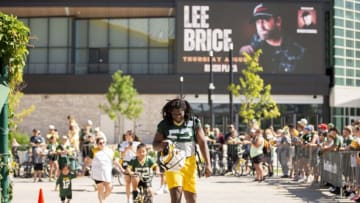 July 28, 2022; Ashwaubenon, WI, USA; Green Bay Packers linebacker Rashan Gary (52) arrives to practice with a big smile during Packers training camp on Thursday, July 28, 2022, at Ray Nitschke Field in Ashwaubenon, Wisconsin. Mandatory Credit: Samantha Madar-USA TODAY Sports