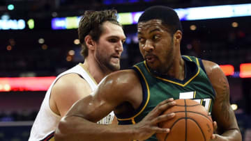 NEW ORLEANS, LA - FEBRUARY 09: Derrick Favors #15 of the Utah Jazz works against Jeff Withey #5 of the New Orleans Pelicans during a game at the Smoothie King Center on February 9, 2015 in New Orleans, Louisiana. NOTE TO USER: User expressly acknowledges and agrees that, by downloading and or using this photograph, User is consenting to the terms and conditions of the Getty Images License Agreement. (Photo by Stacy Revere/Getty Images)