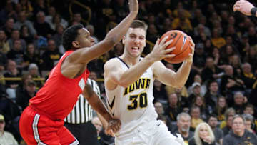 IOWA CITY, IOWA- JANUARY 12: Guard Connor McCaffery #30 of the Iowa Hawkeyes drives to the basket in the second half against guard C.J. Jackson #3 of the Ohio State Buckeyes, on January 12, 2019 at Carver-Hawkeye Arena, in Iowa City, Iowa. (Photo by Matthew Holst/Getty Images)