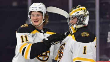 Apr 6, 2021; Philadelphia, Pennsylvania, USA; Boston Bruins center Trent Frederic (11) and Boston Bruins goaltender Jeremy Swayman (1) celebrate win against the Philadelphia Flyers at Wells Fargo Center. Mandatory Credit: Eric Hartline-USA TODAY Sports