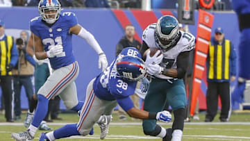 Jan 3, 2016; East Rutherford, NJ, USA; New York Giants cornerback Jayron Hosley (28) tackles Philadelphia Eagles wide receiver Nelson Agholor (17) during the second half at MetLife Stadium. The Eagles won 35-30. Mandatory Credit: Jim O