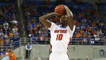 Feb 3, 2016; Gainesville, FL, USA; Florida Gators forward Dorian Finney-Smith (10) takes a shot in the first half against the Arkansas Razorbacks at Stephen C. O