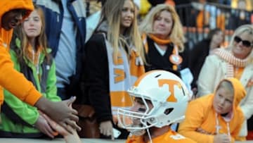 Nov 24, 2012; Knoxville, TN, USA; Tennessee Volunteers quarterback Tyler Bray (8) is congratulated by fans while leaving the field after the game against the Kentucky Wildcats at Neyland Stadium. Tennessee won by a score of 37 to 17. Mandatory Credit: Randy Sartin-USA TODAY Sports
