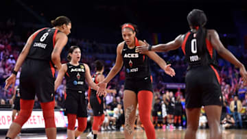 LAS VEGAS, NV - JUNE 29: A'ja Wilson #22 high-fives Liz Cambage #8 and Jackie Young #0 of Las Vegas Aces against the Indiana Fever on June 29, 2019 at the Mandalay Bay Events Center in Las Vegas, Nevada. NOTE TO USER: User expressly acknowledges and agrees that, by downloading and or using this photograph, User is consenting to the terms and conditions of the Getty Images License Agreement. Mandatory Copyright Notice: Copyright 2019 NBAE (Photo by David Becker/NBAE via Getty Images)