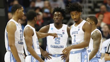 KANSAS CITY, MISSOURI - MARCH 29: Nassir Little #5 and Leaky Black #1 of the North Carolina Tar Heels talk with teammates during the first half against the Auburn Tigers during the 2019 NCAA Basketball Tournament Midwest Regional at Sprint Center on March 29, 2019 in Kansas City, Missouri. (Photo by Jamie Squire/Getty Images)