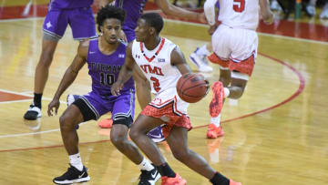 LEXINGTON, VA - JANUARY 20: Trey Bonham #2 of the VMI Keydets dribbles by Alex Hunter #10 of the Furman Paladins during a college basketball game on January 20, 2021 at the Cameron Hall in Lexington, Virginia. (Photo by Mitchell Layton/Getty Images)