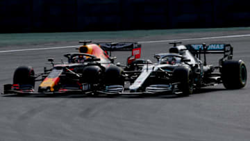 SAO PAULO, BRAZIL - NOVEMBER 17: Max Verstappen of the Netherlands driving the (33) Aston Martin Red Bull Racing RB15 overtakes Lewis Hamilton of Great Britain driving the (44) Mercedes AMG Petronas F1 Team Mercedes W10 on track during the F1 Grand Prix of Brazil at Autodromo Jose Carlos Pace on November 17, 2019 in Sao Paulo, Brazil. (Photo by Charles Coates/Getty Images)