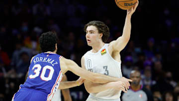Josh Giddey #3 of the Oklahoma City Thunder tries to pass over Furkan Korkmaz #30 of the Philadelphia 76ers during the third quarter at Wells Fargo Center on February 11, 2022 in Philadelphia, Pennsylvania. NOTE TO USER: User expressly acknowledges and agrees that, by downloading and or using this photograph, User is consenting to the terms and conditions of the Getty Images License Agreement. (Photo by Tim Nwachukwu/Getty Images)