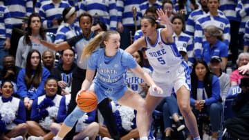 DURHAM, NC - FEBRUARY 26: Alyssa Ustby #1 of the North Carolina Tar Heels moves the ball against Taya Corosdale #5 of the Duke Blue Devils at Cameron Indoor Stadium on February 26, 2023 in Durham, North Carolina. North Carolina won 45-41. (Photo by Lance King/Getty Images)