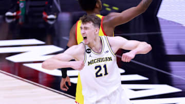 INDIANAPOLIS, INDIANA - MARCH 12: Franz Wagner #21 of the Michigan Wolverines celebrates after making a basket as time expired at the end of the first half in the game against the Maryland Terrapins in the quarterfinals of the Big Ten men's basketball tournament at Lucas Oil Stadium on March 12, 2021 in Indianapolis, Indiana. (Photo by Justin Casterline/Getty Images)