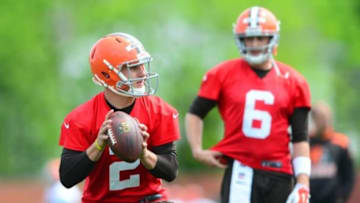 May 21, 2014; Berea, OH, USA; Cleveland Browns quarterback Johnny Manziel (2) looks to pass as quarterback Brian Hoyer (6) looks on during organized team activities at Cleveland Browns practice facility. Mandatory Credit: Andrew Weber-USA TODAY Sports