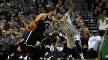 Jan 2, 2016; Boston, MA, USA; Boston Celtics forward Amir Johnson (90) guards Brooklyn Nets center Brook Lopez (11) during the second half at TD Garden. Mandatory Credit: Bob DeChiara-USA TODAY Sports