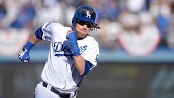 Oct 11, 2016; Los Angeles, CA, USA; Los Angeles Dodgers right fielder Josh Reddick (11) scores on a double by Los Angeles Dodgers center fielder Joc Pederson (not pictured) in the fifth inning against the Washington Nationals during game four of the 2016 NLDS playoff baseball series at Dodger Stadium. Mandatory Credit: Gary A. Vasquez-USA TODAY Sports