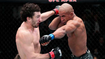 LAS VEGAS, NEVADA - FEBRUARY 26: (R-L) Gregory Rodrigues of Brazil punches Armen Petrosyan of Armenia in their middleweight fight during the UFC Fight Night event at UFC APEX on February 26, 2022 in Las Vegas, Nevada. (Photo by Chris Unger/Zuffa LLC)