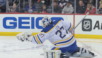 Apr 11, 2023; Newark, New Jersey, USA; Buffalo Sabres goaltender Devon Levi (27) makes a glove save during the third period against the New Jersey Devils at Prudential Center. Mandatory Credit: Vincent Carchietta-USA TODAY Sports