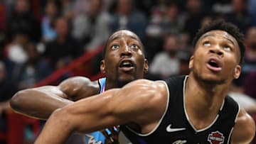 Miami Heat forward Bam Adebayo (back) battles for a rebound against Milwaukee Bucks forward Giannis Antetokounmpo (Jim Rassol-USA TODAY Sports)