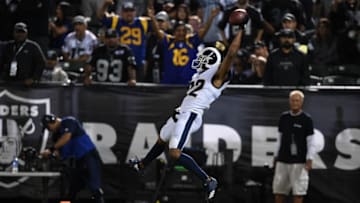 OAKLAND, CA - SEPTEMBER 10: Marcus Peters #22 of the Los Angeles Rams dives into the endzone after an interception of Derek Carr #4 of the Oakland Raiders in the fourth quarter of their NFL game at Oakland-Alameda County Coliseum on September 10, 2018 in Oakland, California. (Photo by Thearon W. Henderson/Getty Images)