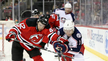 NEWARK, NJ - MARCH 19: John Quenneville #42 of the New Jersey Devils pushes Matt Calvert #11 of the Columbus Blue Jackets during the third period on March 19, 2017 at the Prudential Center in Newark, New Jersey. (Photo by Christopher Pasatieri/Getty Images)