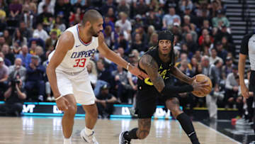 Oct 27, 2023; Salt Lake City, Utah, USA; Utah Jazz guard Jordan Clarkson (00) moves the ball against Los Angeles Clippers forward Nicolas Batum (33) in the second quarter at Delta Center. Mandatory Credit: Rob Gray-USA TODAY Sports