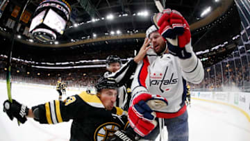 BOSTON, MA - NOVEMBER 16: Washington Capitals right wing Tom Wilson (43) hits Boston Bruins left wing Brad Marchand (63) during a game between the Boston Bruins and the Washington Capitals on November 16, 2019, at TD Garden in Boston, Massachusetts. (Photo by Fred Kfoury III/Icon Sportswire via Getty Images)