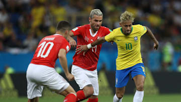 ROSTOV-ON-DON, RUSSIA - JUNE 17: Neymar Jr of Brazil is challenged by Valon Behrami of Switzerland and Granit Xhaka of Switzerland during the 2018 FIFA World Cup Russia group E match between Brazil and Switzerland at Rostov Arena on June 17, 2018 in Rostov-on-Don, Russia. (Photo by Buda Mendes/Getty Images)