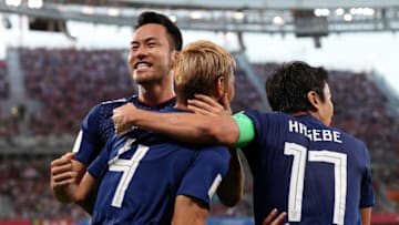 YEKATERINBURG, RUSSIA - JUNE 24: Keisuke Honda of Japan celebrates with teammate Maya Yoshida after scoring his team's second goal during the 2018 FIFA World Cup Russia group H match between Japan and Senegal at Ekaterinburg Arena on June 24, 2018 in Yekaterinburg, Russia. (Photo by Clive Rose/Getty Images)