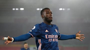 SOUTHAMPTON, ENGLAND - JANUARY 26: Nicolas Pepe of Arsenal celebrates after scoring his team's first goal during the Premier League match between Southampton and Arsenal at St Mary's Stadium on January 26, 2021 in Southampton, England. Sporting stadiums around the UK remain under strict restrictions due to the Coronavirus Pandemic as Government social distancing laws prohibit fans inside venues resulting in games being played behind closed doors. (Photo by Marc Atkins/Getty Images)