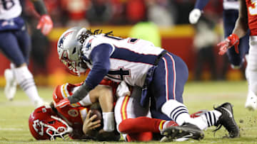 KANSAS CITY, MISSOURI - JANUARY 20: Patrick Mahomes #15 of the Kansas City Chiefs is tackled by Adrian Clayborn #94 of the New England Patriots in the first half during the AFC Championship Game at Arrowhead Stadium on January 20, 2019 in Kansas City, Missouri. (Photo by Patrick Smith/Getty Images)