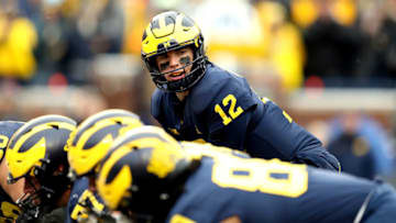 ANN ARBOR, MICHIGAN - NOVEMBER 27: Cade McNamara #12 of the Michigan Wolverines looks up before the snap in the third quarter against the Ohio State Buckeyes at Michigan Stadium on November 27, 2021 in Ann Arbor, Michigan. (Photo by Mike Mulholland/Getty Images)