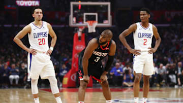 LOS ANGELES, CALIFORNIA - APRIL 03: Chris Paul #3 of the Houston Rockets, Landry Shamet #20 and Shai Gilgeous-Alexander #2 of the Los Angeles Clippers look on during the first half at Staples Center on April 03, 2019 in Los Angeles, California. NOTE TO USER: User expressly acknowledges and agrees that, by downloading and or using this photograph, User is consenting to the terms and conditions of the Getty Images License Agreement. (Photo by Yong Teck Lim/Getty Images)