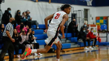 Ypsi Prep forward Emoni Bates (21) runs back to play for defense after dunking against SPIRE Academy during the second half at Central Academy in Ann Arbor, Saturday, March 13, 2021.