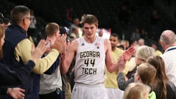 Dec 28, 2016; Atlanta, GA, USA; Georgia Tech Yellow Jackets center Ben Lammers (44) celebrates with fans after their win against the North Carolina A&T Aggies at McCamish Pavilion. Georgia Tech won 59-52. Mandatory Credit: Jason Getz-USA TODAY Sports