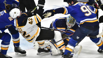 ST. LOUIS, MO - JUN 03: St. Louis Blues center Ryan O'Reilly (90) knocks down Boston Bruins rightwing David Backes (42) late in the game during Game 4 of the Stanley Cup Final between the Boston Bruins and the St. Louis Blues, on June 01, 2019, at Enterprise Center, St. Louis, Mo. (Photo by Keith Gillett/Icon Sportswire via Getty Images)
