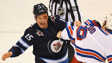 WINNEPEG, MB - FEBRUARY 11: Winnipeg Jets Center Matt Hendricks (15) and New York Rangers Left Wing Cody McLeod (8) fight in the 2nd period during a NHL game between the Winnipeg Jets and New York Rangers on February 11, 2018 at Bell MTS Centre in Winnepeg, MB. The Rangers defeated the Jets 3-1.(Photo by Nick Wosika/Icon Sportswire via Getty Images)